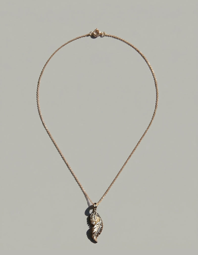 flame of the phoenix pendant | 18ct gold feather necklace